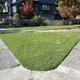 Valley Drive is quite slanted compared to the neat east-west alignment of adjacent streets, hence the lots with rounded corners resulting in these “triangle” curbside grass patches